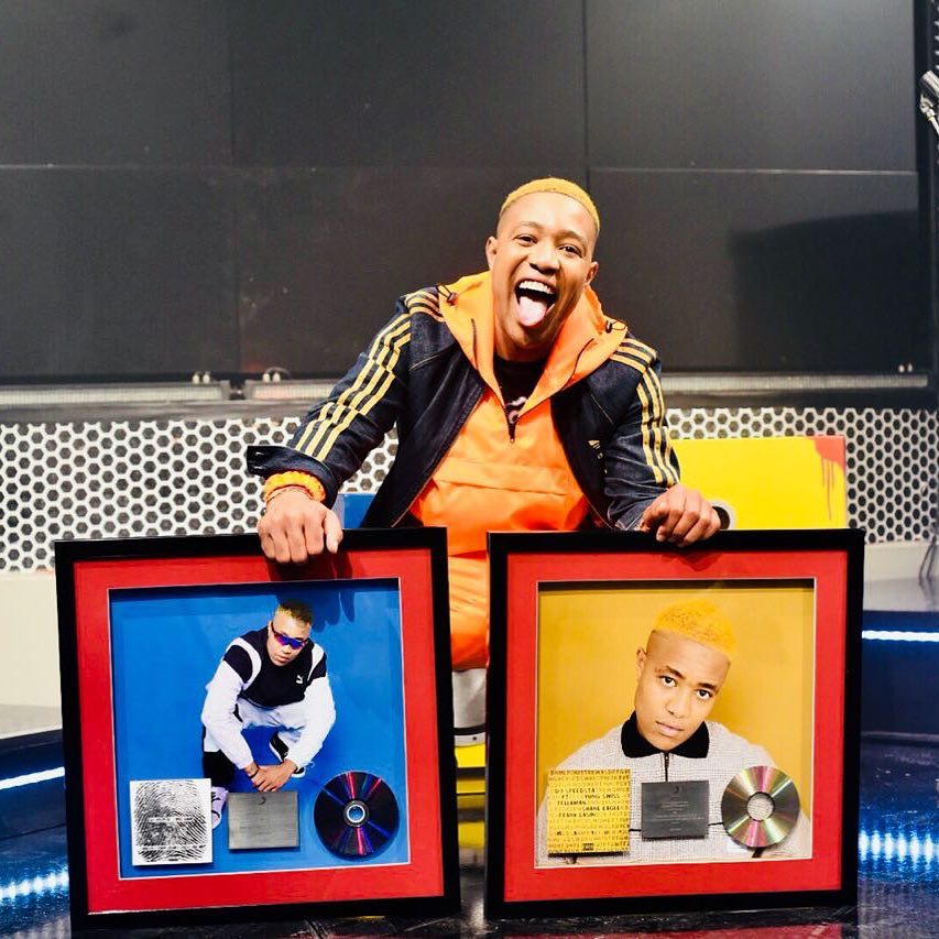 Dj Speedsta receives surprise plaques for his two hit records.