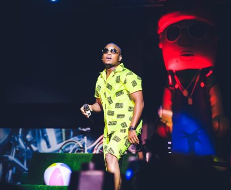 K.O receives a plaque for a record he did with Nigerian hitmaker, Runtown