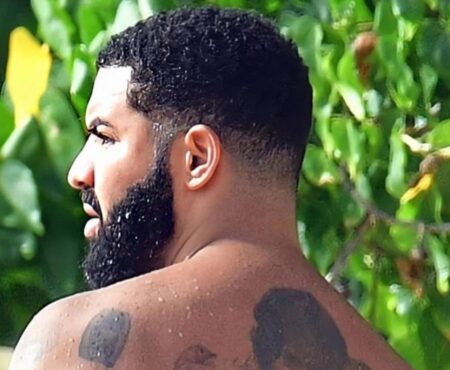 Drake shows off his body full of massive tattoos